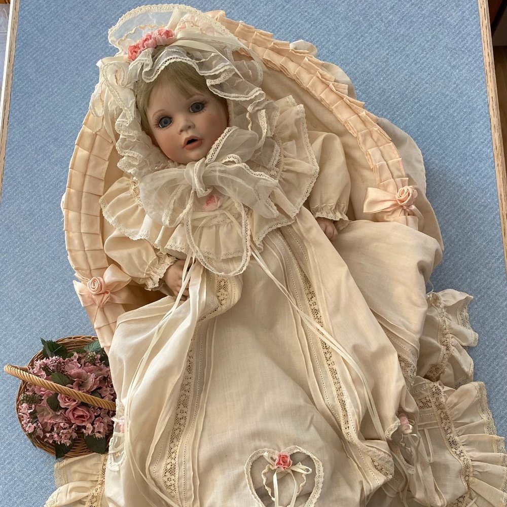 Porcelain baby in bassinet